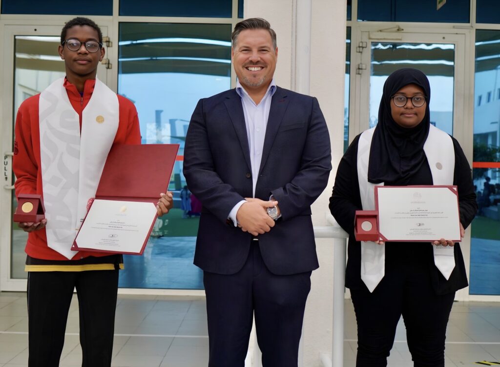 SIA principal with two student awardees