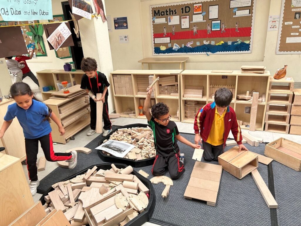 young learners arranging wood blocks